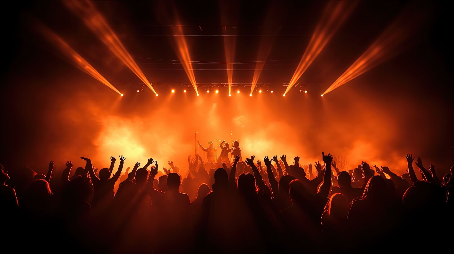 medium-crowd-at-a-concert-claps-while-musicians-perform-onstage-illuminated-by-spotlight-with-dancing-people-silhouette-concept