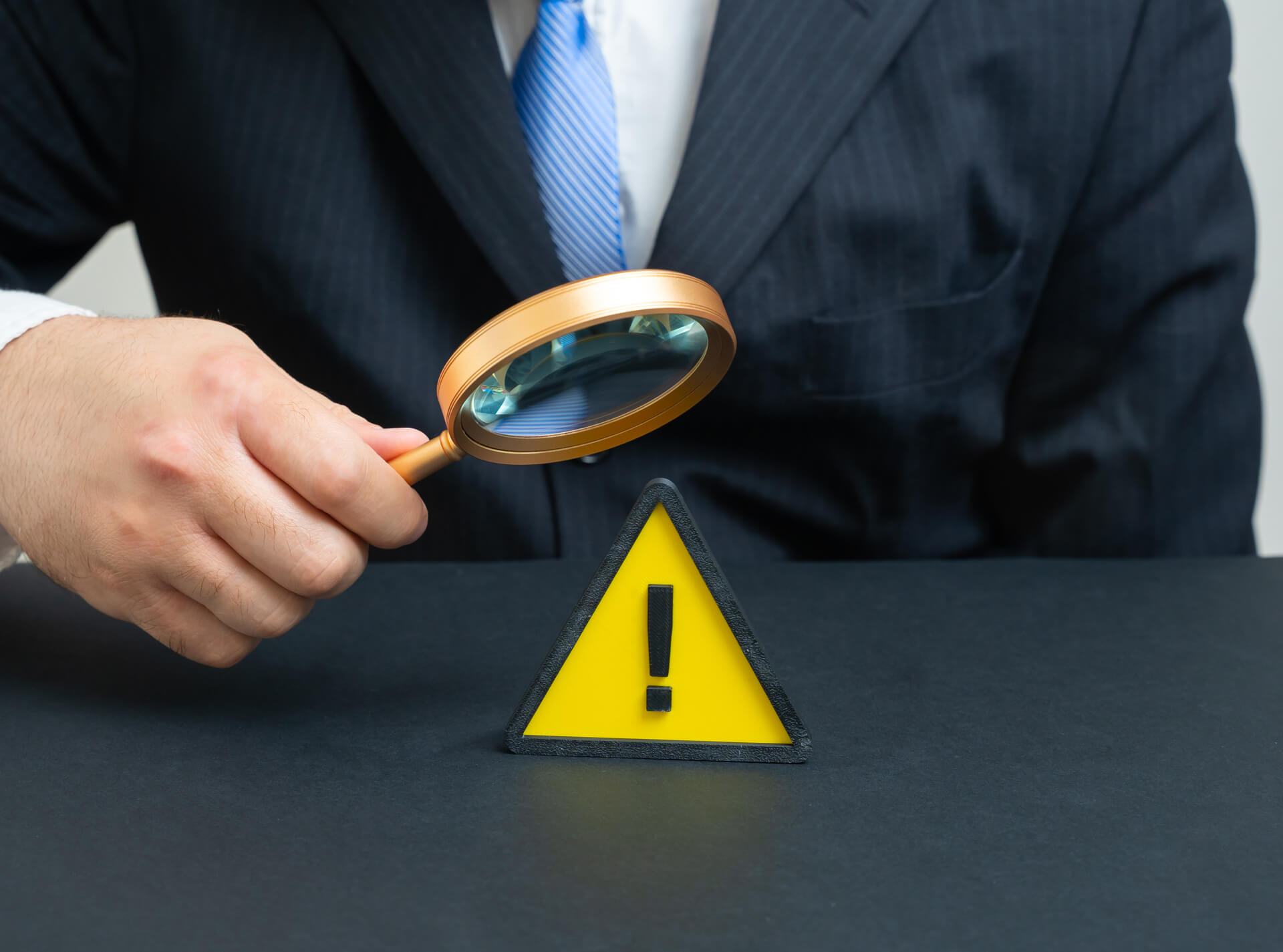 medium-vecteezy_a-businessman-studies-a-problem-a-warning-sign-signals-a_70659189_medium